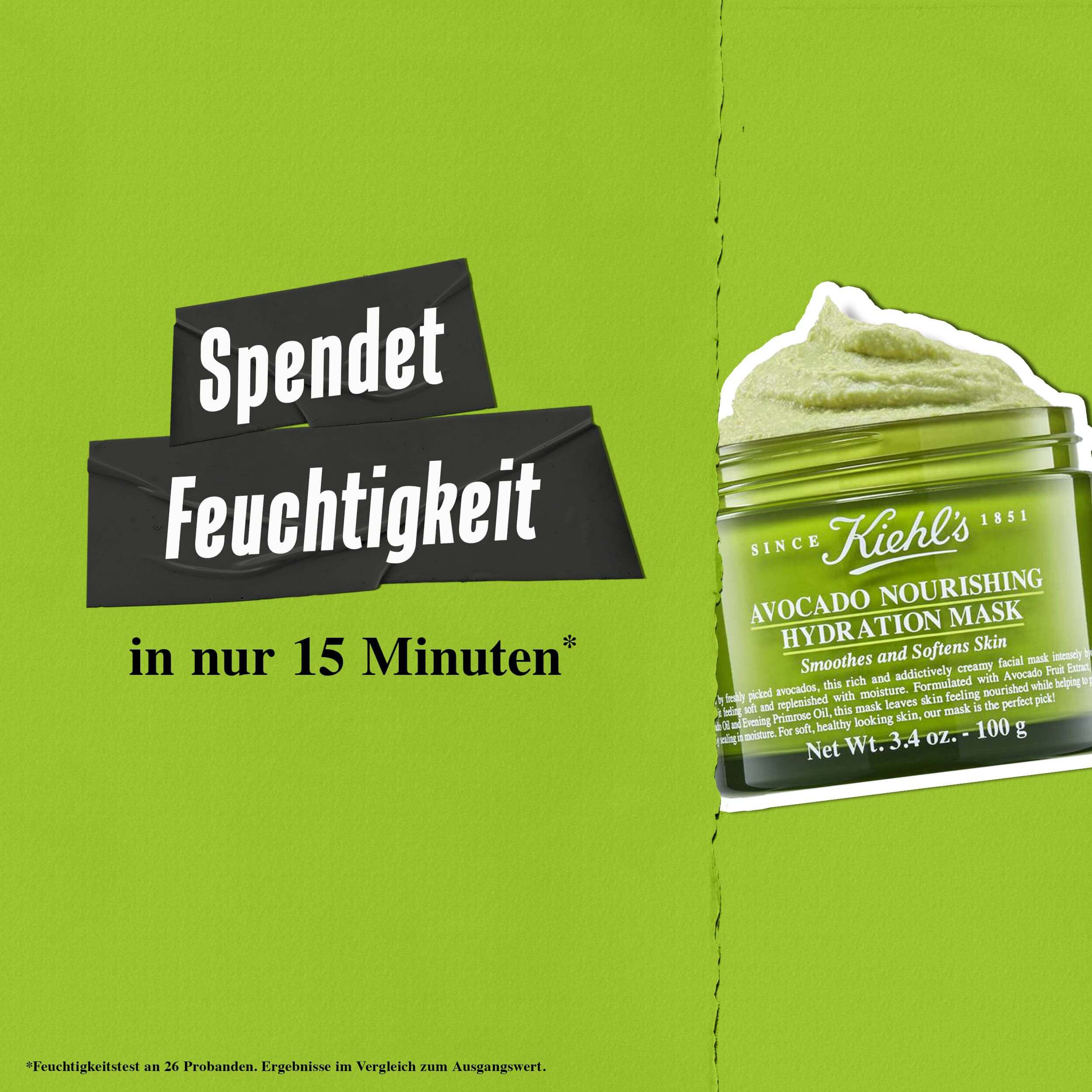 Model halt einen Tiegel der Kiehl's Avocado Nourishing Hydration Mask – glattet und macht die Haut geschmeidig
