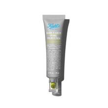 A tube of Kiehl’s Rare Earth Pore Tightening Treatment. The tube is grey with a green applicator and a clear cap.