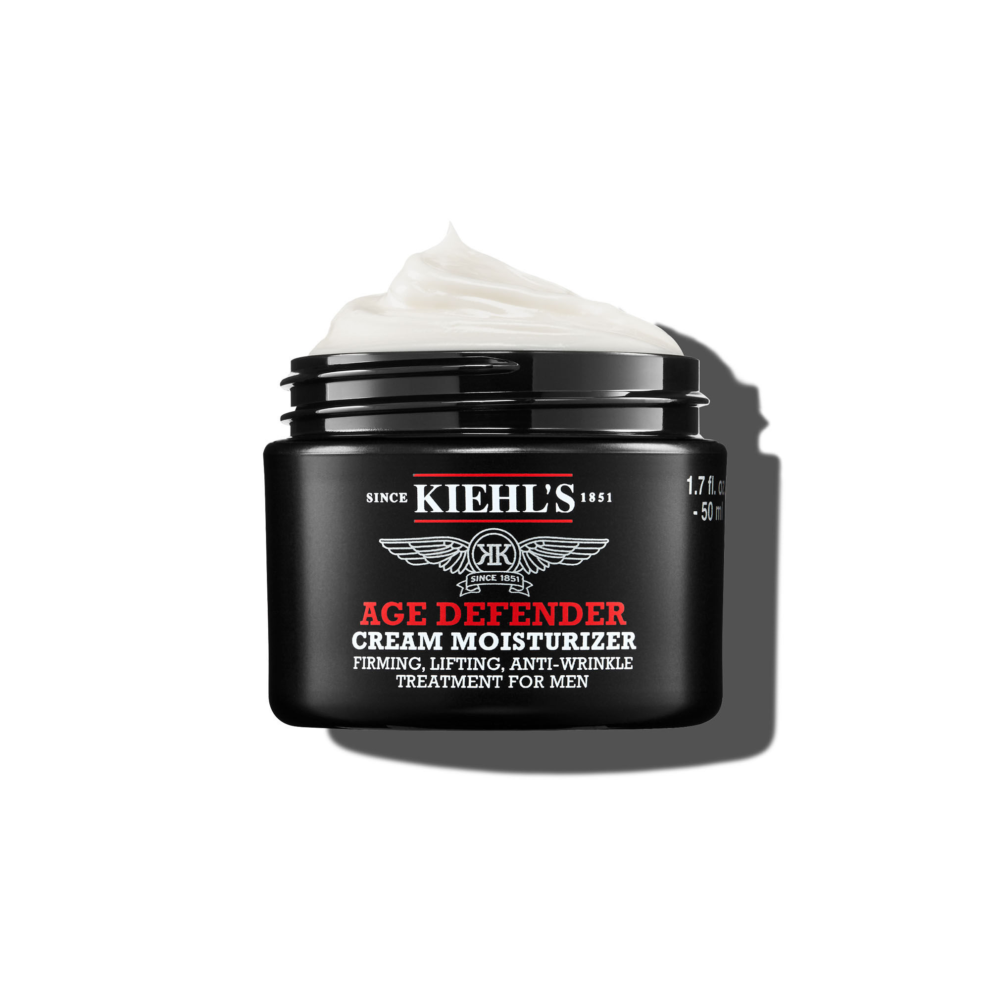 Ein 50-ml-Tiegel Kiehl's Age Defender Cream Moisturizer mit aufgeschlagener Textur vor weißem Hintergrund.
