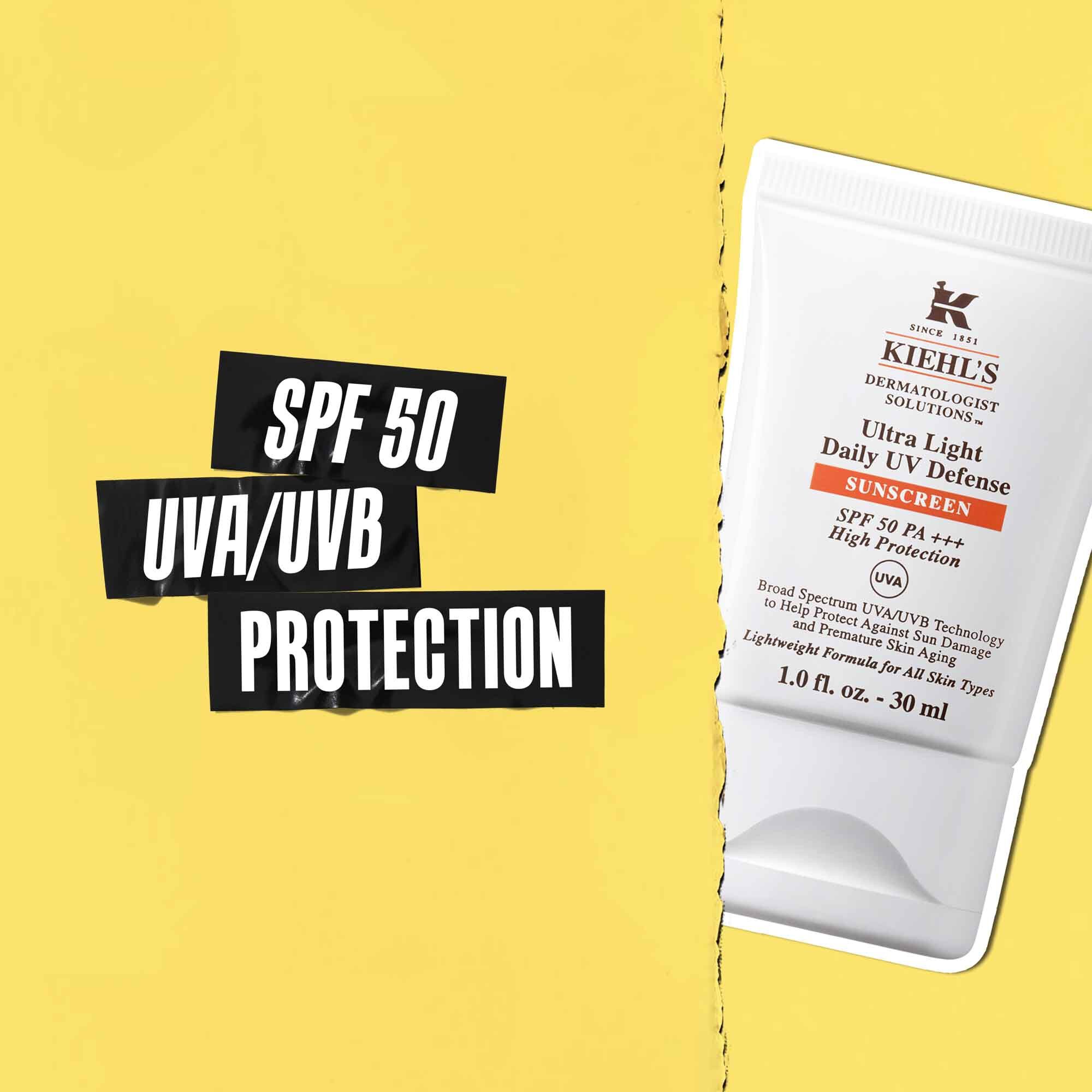 Mention SPF 50 UVA/UVB Protection sur ruban noir avec une image du tube Ultra-Light Daily UV Defense a cote.