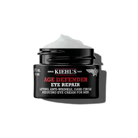 Ein 14-ml-Tiegel Kiehl's Age Defender Eye Repair mit aufgeschlagener Textur vor weißem Hintergrund.