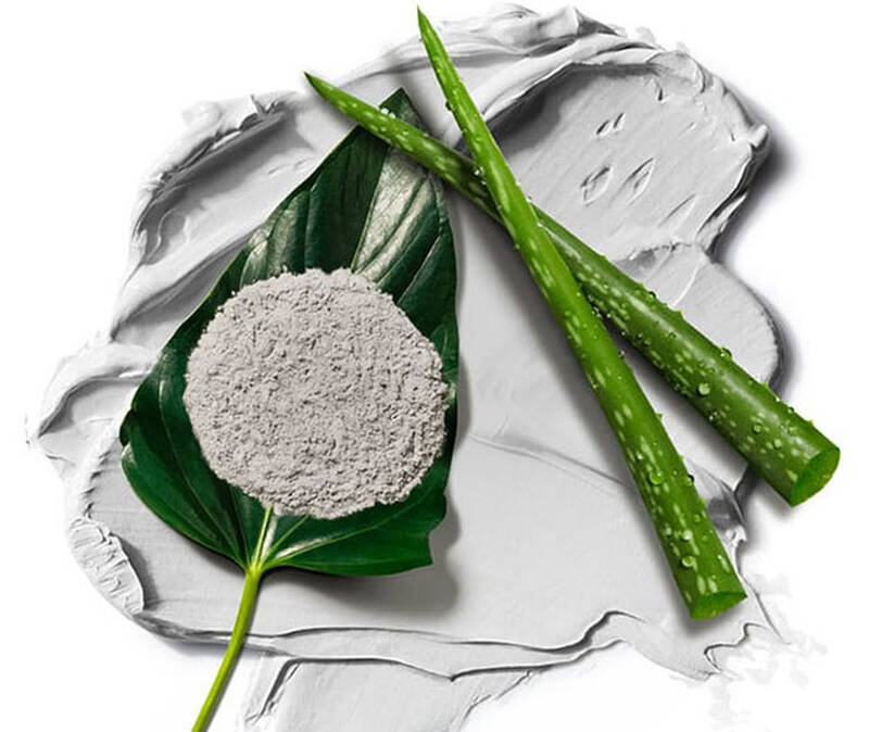 Verschiedene Inhaltsstoffe auf einer grauen Creme