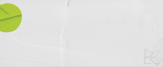 Ein gruner Punkt auf einem weißen Hintergrund, daneben ein verschwommener Schriftzug.