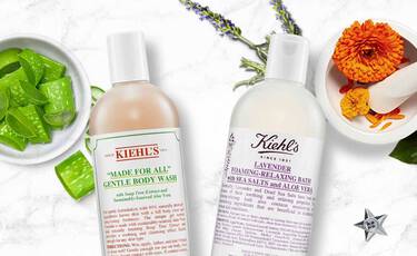 Kiehl's Duschgel "Made for All" und Lavendel-Schaumbad mit Aloe und Meersalz, umgeben von Aloe Vera und Blumen.