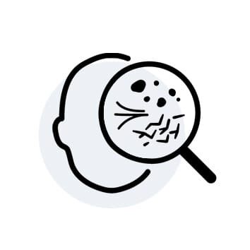 A simple line drawing of a head with a magnifying glass examining the surface, highlighting small details and imperfections.