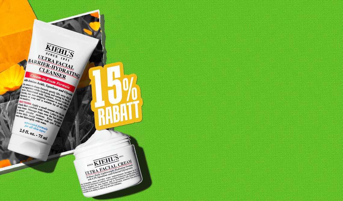 Kiehl’s Ultra Facial Barrier-Hydrating Cleanser und Ultra Facial Cream auf grunem Hintergrund mit gelben Blumen und einem gelben Schild mit „15% Rabatt“.