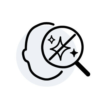 An illustration of a head silhouette with a magnifying glass overlay featuring sparkling elements, suggesting analysis or enhancement.