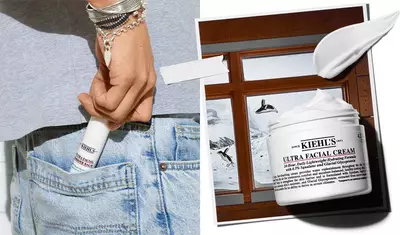 A person holding a tube of Kiehl's Ultra Facial Cream, with the product prominently displayed next to an image of the cream in a jar against a wintery background.