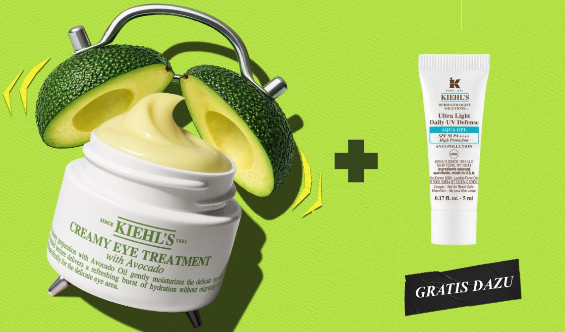 Kiehl's Creamy Eye Treatment with Avocado zusammen mit einer gratis Probe des Ultra Light Daily UV Defense Aqua Gel LSF 50 PA++++, auf grunem Hintergrund mit Avocadohalfte