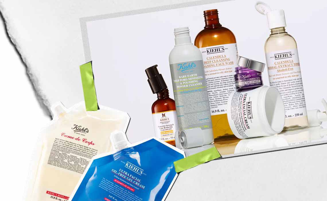 Eine Kollektion von Kiehl's Hautpflegeprodukten, darunter Lotionen und Seren, kunstvoll arrangiert mit leuchtenden Verpackungen und sichtbaren Etiketten.