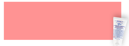 Creme pour les mains de Kiehl's sur fond rose.