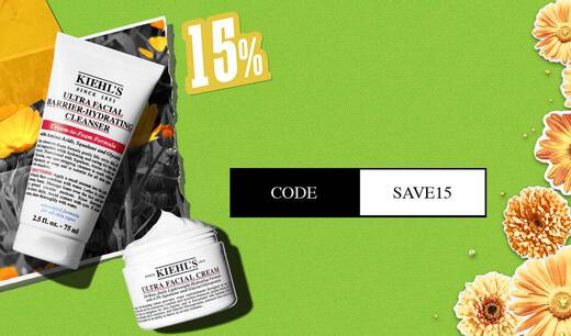 Visuel promotionnel sur fond vert avec des fleurs presentant le nettoyant Ultra Facial Barrier‑Hydrating et la creme Ultra Facial de Kiehl’s. Le texte annonce « 15 % de reduction a partir du 2ᵉ produit » avec le code « SAVE15 ».