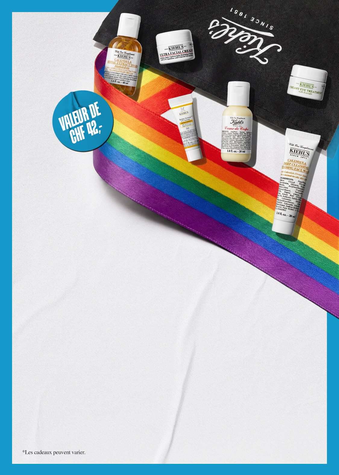 Coffret Pride Kiehl's d'une valeur de CHF 42,- comprenant des mini-produits : Ultra Facial Cream, Calendula Herbal-Extract Toner, Creme de Corps et Calendula Deep Cleansing Face Wash, decores d'un ruban arc-en-ciel sur un sac Kiehl's